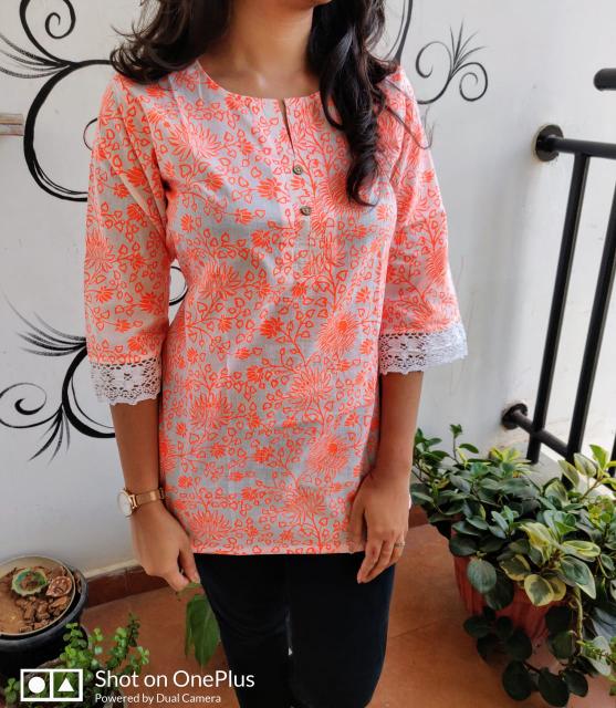 white and orange short kurta or short top